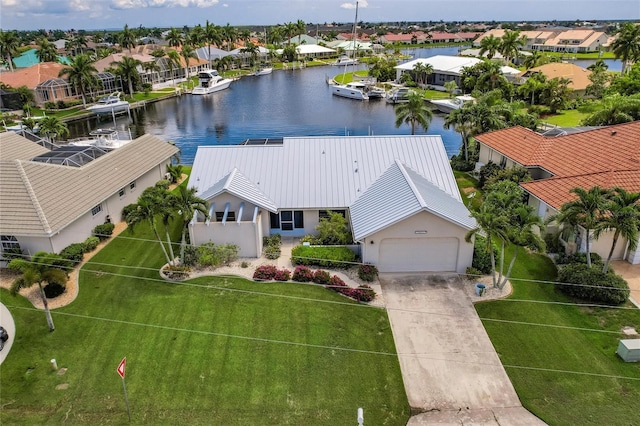 birds eye view of property featuring a water view