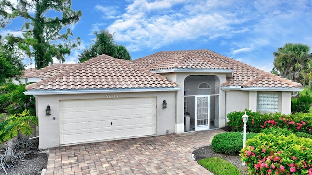 mediterranean / spanish-style home featuring a garage