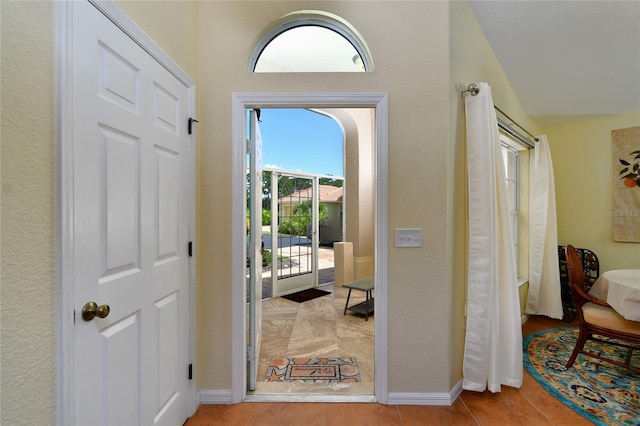 foyer featuring light tile patterned floors