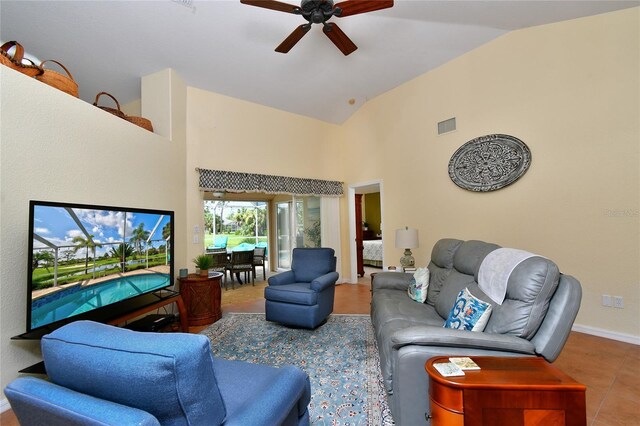 living room with tile patterned flooring, high vaulted ceiling, and ceiling fan