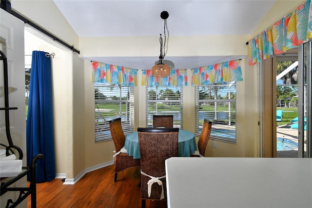 dining area with hardwood / wood-style flooring and a healthy amount of sunlight