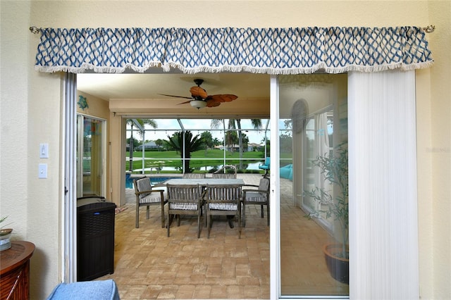 exterior space featuring ceiling fan