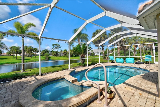 view of swimming pool with an in ground hot tub, a water view, a patio, and a lanai