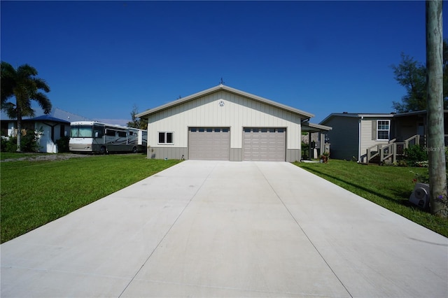 view of front of property with a front yard and a garage