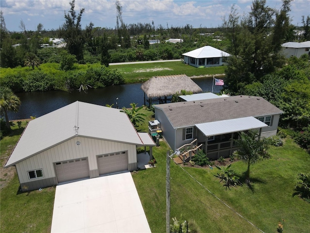 birds eye view of property with a water view