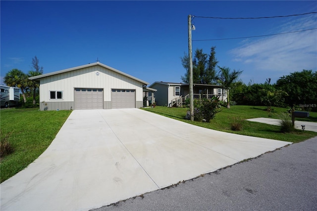 view of front of house with a front lawn and a garage