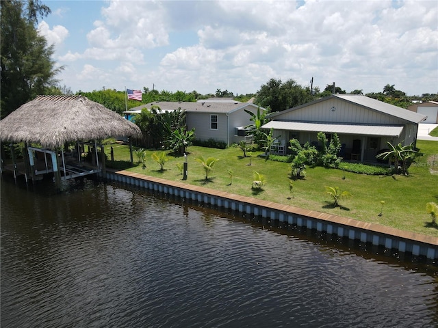 dock area featuring a yard and a water view