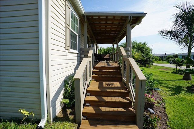 view of side of property featuring a yard and a porch