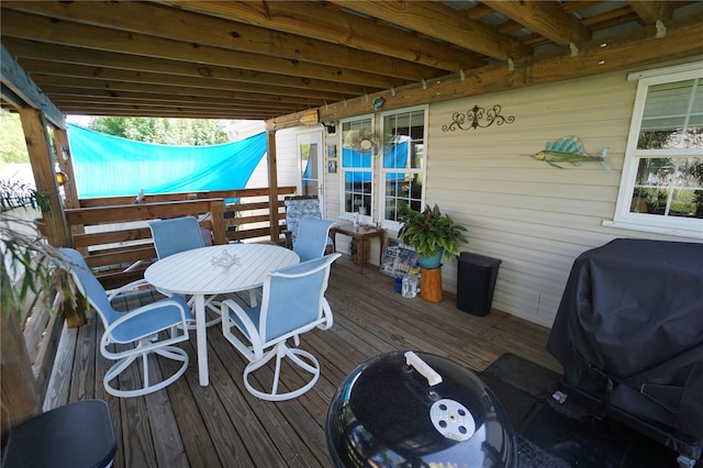 wooden terrace featuring a grill