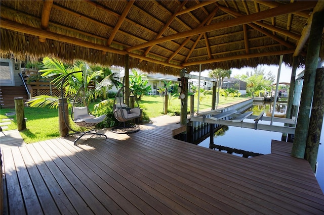 dock area with a gazebo and a lawn