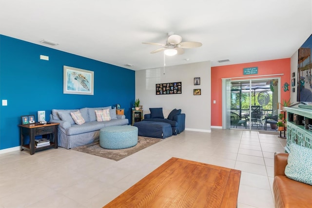 living room with ceiling fan and light tile patterned floors