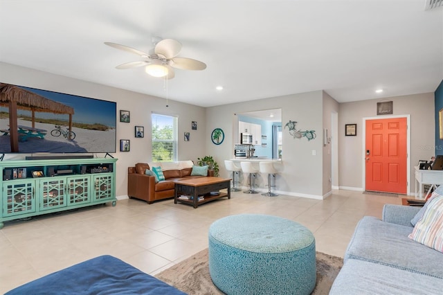 tiled living room with ceiling fan