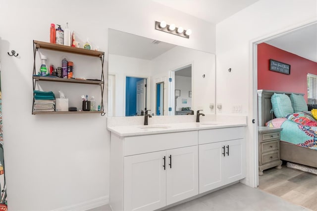 bathroom with vanity and wood-type flooring