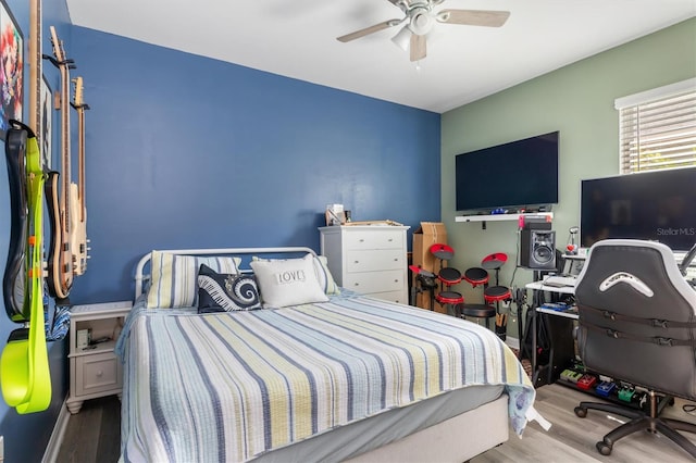 bedroom featuring ceiling fan and light hardwood / wood-style floors