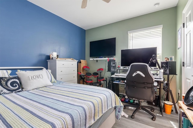 bedroom featuring ceiling fan and light hardwood / wood-style flooring