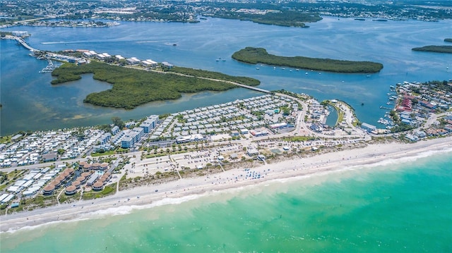 birds eye view of property featuring a water view and a beach view