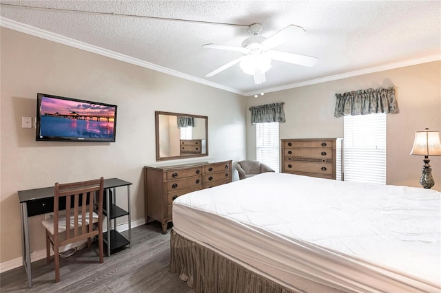 bedroom with ceiling fan, dark hardwood / wood-style flooring, a textured ceiling, and crown molding