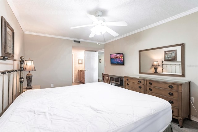 bedroom with a textured ceiling, ceiling fan, and crown molding