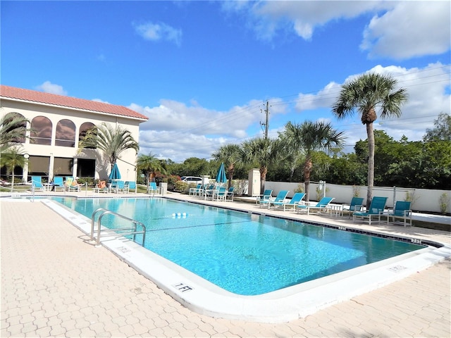 view of swimming pool with a patio area