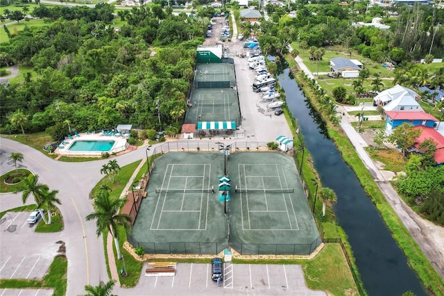 birds eye view of property with a water view