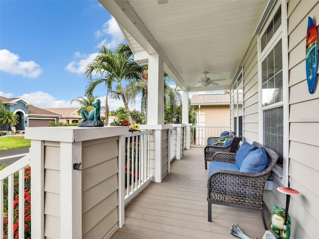 wooden deck featuring ceiling fan and a porch