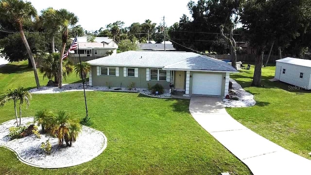 ranch-style home with a garage and a front yard