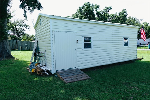 view of outdoor structure with a lawn