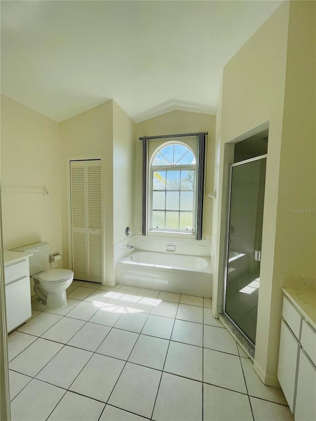 full bathroom featuring tile patterned flooring, plus walk in shower, vaulted ceiling, and toilet