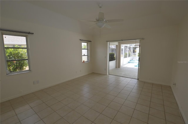515 Allworthy St, Port Charlotte, FL 33954 - empty room with light tile patterned floors, baseboards, and a ceiling fan