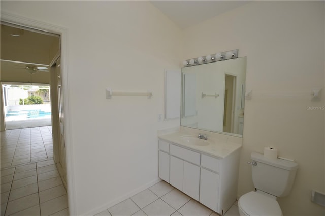 515 Allworthy St, Port Charlotte, FL 33954 - bathroom featuring baseboards, toilet, ceiling fan, vanity, and tile patterned floors
