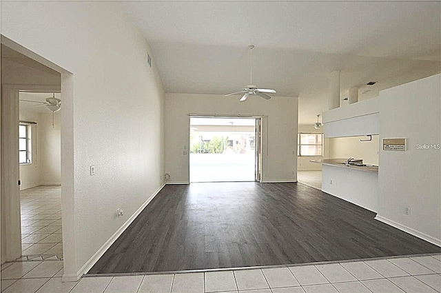 515 Allworthy St, Port Charlotte, FL 33954 - unfurnished living room featuring baseboards, a ceiling fan, visible vents, lofted ceiling, and wood finished floors