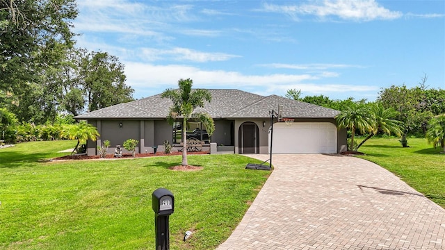 ranch-style home featuring a garage and a front lawn