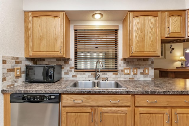 kitchen featuring sink, dishwasher, and decorative backsplash