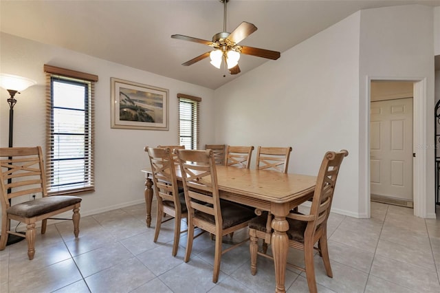 dining room with plenty of natural light, light tile patterned floors, and lofted ceiling