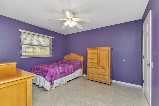 tiled bedroom with ceiling fan