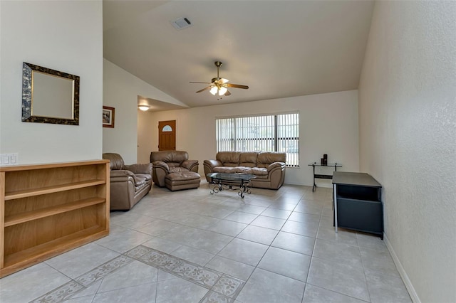 living room with ceiling fan, light tile patterned floors, and vaulted ceiling