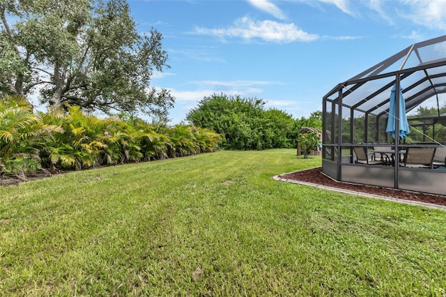 view of yard with a lanai