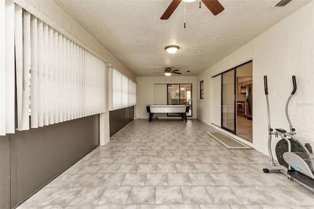 hallway featuring a textured ceiling