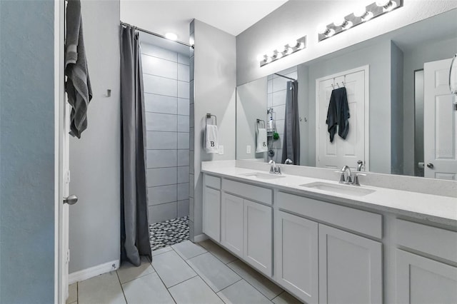 16195 Maya Cir, Punta Gorda, FL 33955 - bathroom featuring double vanity, a tile shower, and tile patterned floors