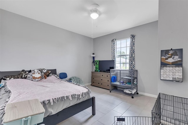 16195 Maya Cir, Punta Gorda, FL 33955 - bedroom featuring baseboards, light tile patterned floors, and a ceiling fan
