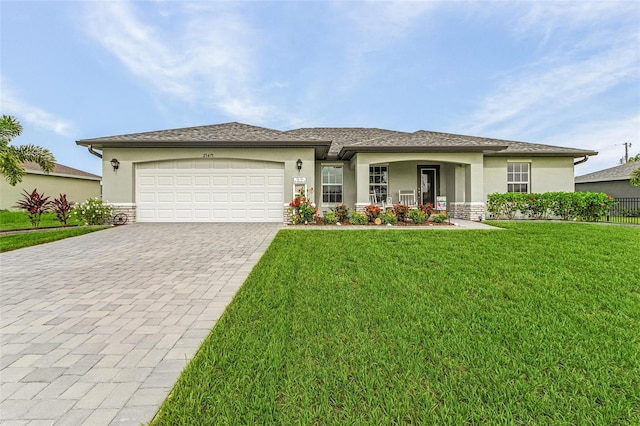 view of front facade with a garage and a front lawn