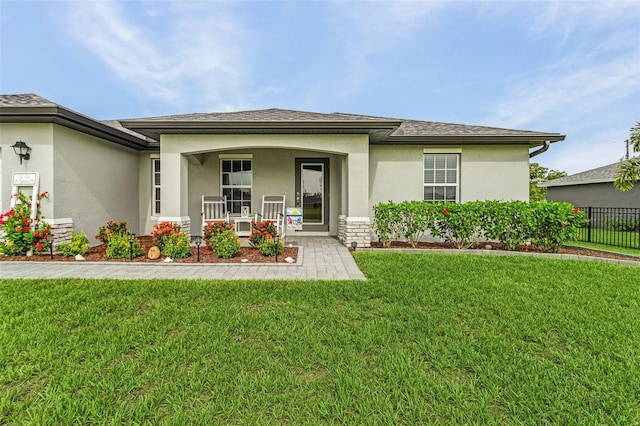 view of front of home featuring a porch and a front lawn