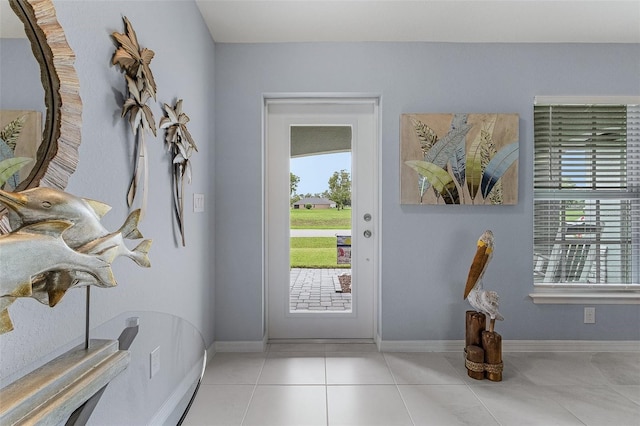 tiled foyer featuring a wealth of natural light