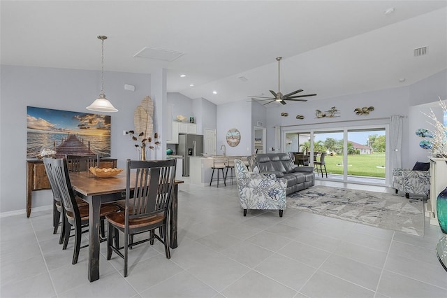 dining area featuring light tile patterned floors, high vaulted ceiling, and ceiling fan