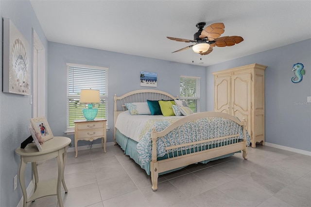 tiled bedroom with ceiling fan