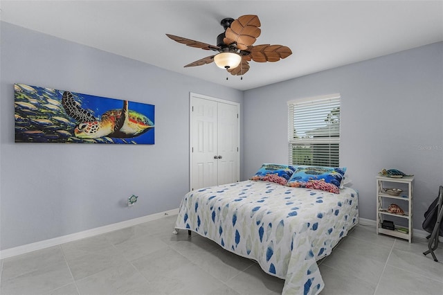 tiled bedroom with a closet and ceiling fan