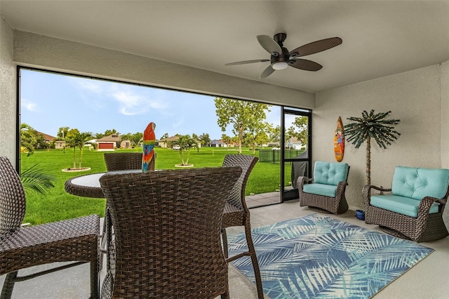 sunroom / solarium with ceiling fan