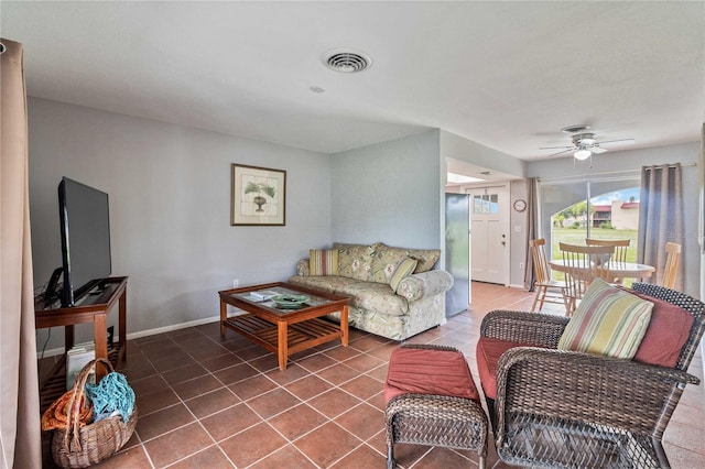 tiled living room featuring ceiling fan