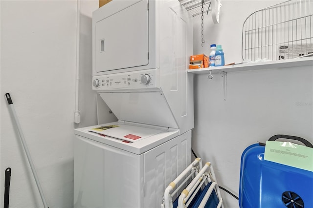 washroom with stacked washer and dryer