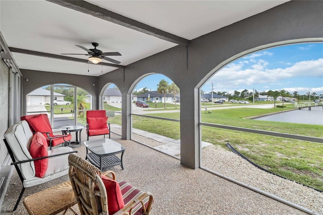 sunroom / solarium with ceiling fan